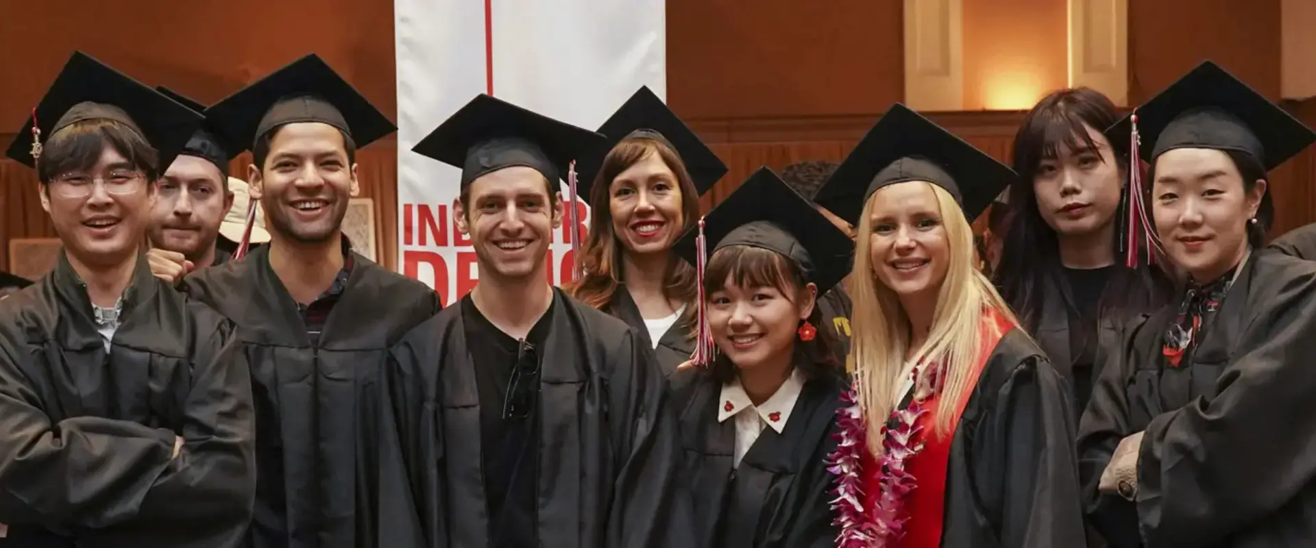 group of recent graduates posing for a picture